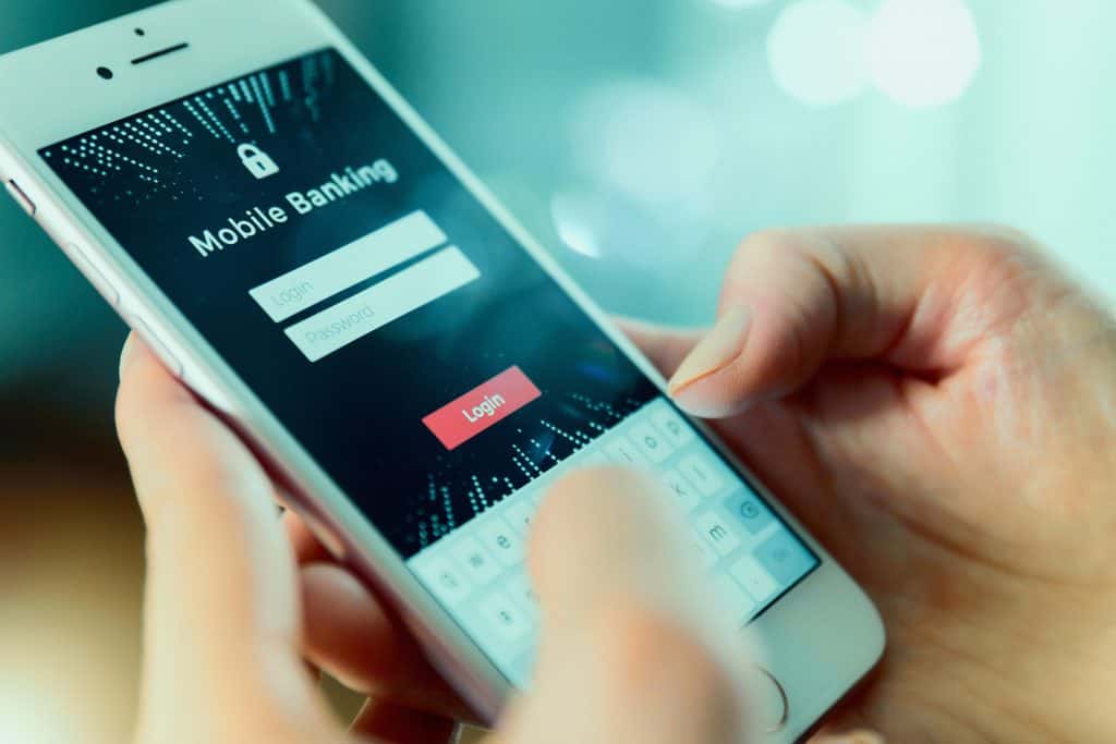 A person logging in to a mobile banking app